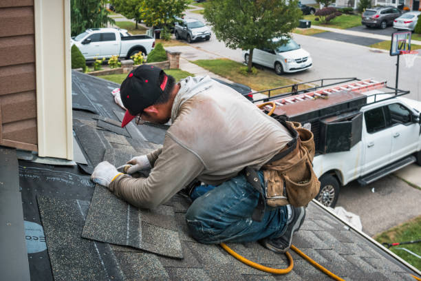 Professional Roofing technician working in Winsted, CT